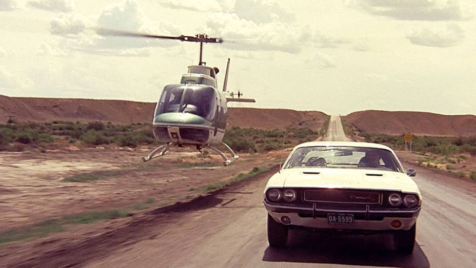 Corrida Contra o Destino (1971) - Pode o mito de um carro nascer no cinema? Sim, &eacute; o caso do Dodge Challenger, produzido s&oacute; de 1970 a 1974, ocaso dos pony-cars, mas sempre lembrado pelo filme. <a href="%20https://beta-develop.quatrorodas.abril.com.br/blogs/planeta-carro/" rel="migration"></a>