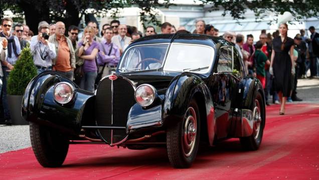 Bugatti 57SC 1938 | <a href="https://beta-develop.quatrorodas.abril.com.br/noticias/fabricantes/bugatti-1938-ralph-lauren-vence-concurso-elegancia-742534.shtml" rel="migration">Leia mais</a> Bugatti 57SC 1938 | <a href="https://beta-develop.quatrorodas.abril.com.br/noticias/fabricantes/bugatti-1938-ralph-lauren-vence-concurso-elegancia-742534.shtml" rel="migration">Leia mais</a>