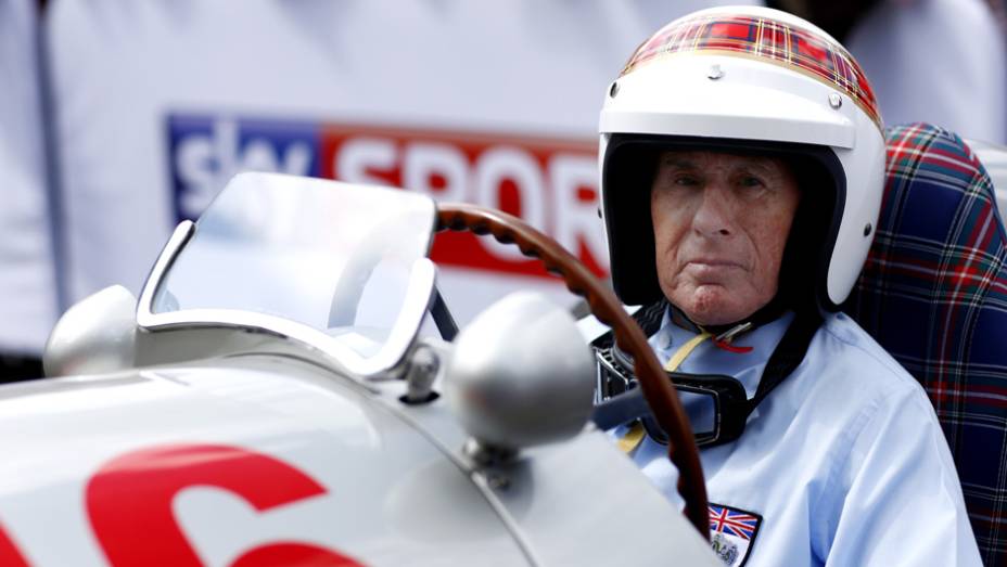 Uma das presenças ilustres foi a do tricampeão mundial de F-1, sir Jackie Stewart | <a href="https://beta-develop.quatrorodas.abril.com.br/galerias/especiais/festival-goodwood-2014-parte-1-787499.shtml" rel="migration">Parte 1</a>