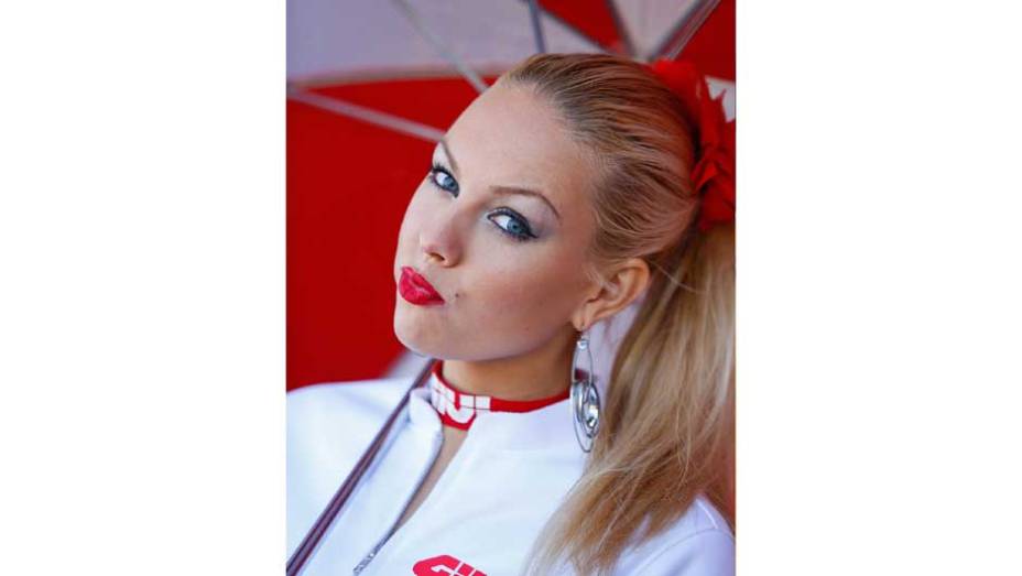 Veja as belas Garotas da MotoGP - Valencia | <a href="https://beta-develop.quatrorodas.abril.com.br/moto/noticias/lorenzo-vence-nao-impede-titulo-marquez-759873.shtml" rel="migration">Leia mais</a>