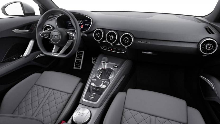 Internamente, o novo TT é equipado com volante de base achatada, display de informações de 12,3 polegadas... | <a href="https://beta-develop.quatrorodas.abril.com.br/noticias/saloes/genebra-2014/audi-apresenta-novo-tt-775222.shtml" rel="migration">Leia mais</a>