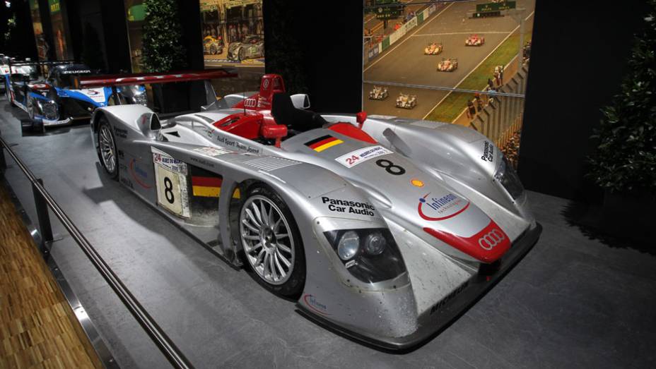 Audi R8 (2000) | <a href="https://beta-develop.quatrorodas.abril.com.br/noticias/saloes/genebra-2014/salao-genebra-exibe-bolidos-le-mans-775992.shtml" rel="migration">Leia mais</a> | <a href="https://beta-develop.quatrorodas.abril.com.br/noticias/saloes/genebra-2014/" rel="migration">Confira tudo sobre o Salão de</a> Audi R8 (2000) | <a href="https://beta-develop.quatrorodas.abril.com.br/noticias/saloes/genebra-2014/salao-genebra-exibe-bolidos-le-mans-775992.shtml" rel="migration">Leia mais</a> | <a href="https://beta-develop.quatrorodas.abril.com.br/noticias/saloes/genebra-2014/" rel="migration">Confira tudo sobre o Salão de</a>