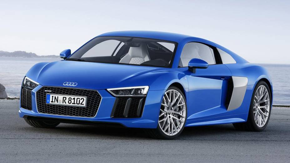 O Audi R8 passou por uma dieta rígida e perdeu 200 kg em sua nova geração | <a href="https://beta-develop.quatrorodas.abril.com.br/noticias/saloes/genebra-2015/audi-revela-oficialmente-nova-geracao-esportivo-r8-841481.shtml" rel="migration">Leia mais</a>