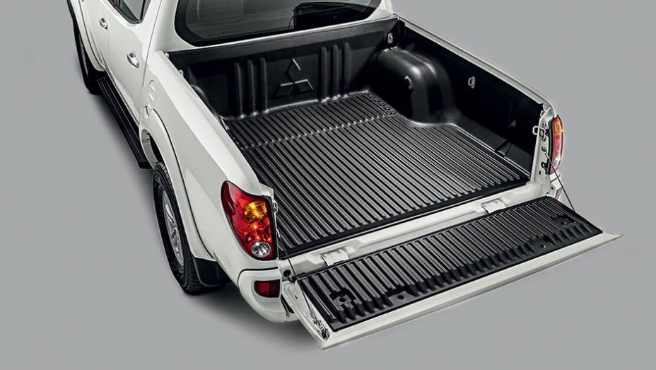 A capacidade de carga é de 1 095 kg. | <a href="https://beta-develop.quatrorodas.abril.com.br/carros/testes/mitsubishi-l200-triton-764187.shtml" rel="migration">Leia mais</a> A capacidade de carga é de 1 095 kg. | <a href="https://beta-develop.quatrorodas.abril.com.br/carros/testes/mitsubishi-l200-triton-764187.shtml" rel="migration">Leia mais</a>