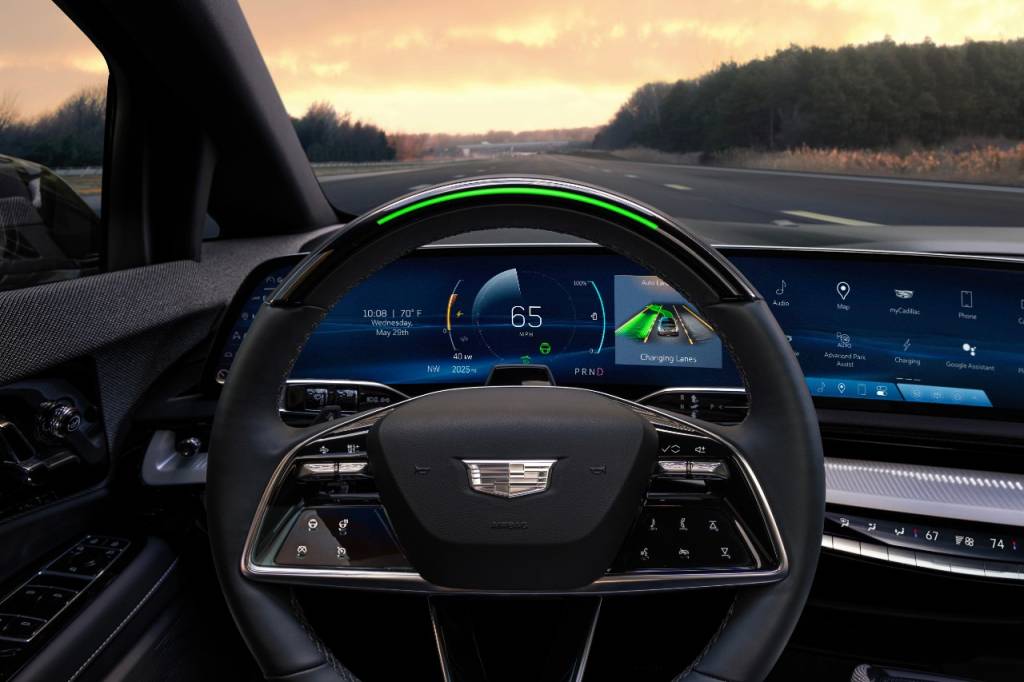2025 Cadillac OPTIQ View of the 2025 Cadillac OPTIQ steering wheel with standard Super Cruise and steering wheel light bar activated.