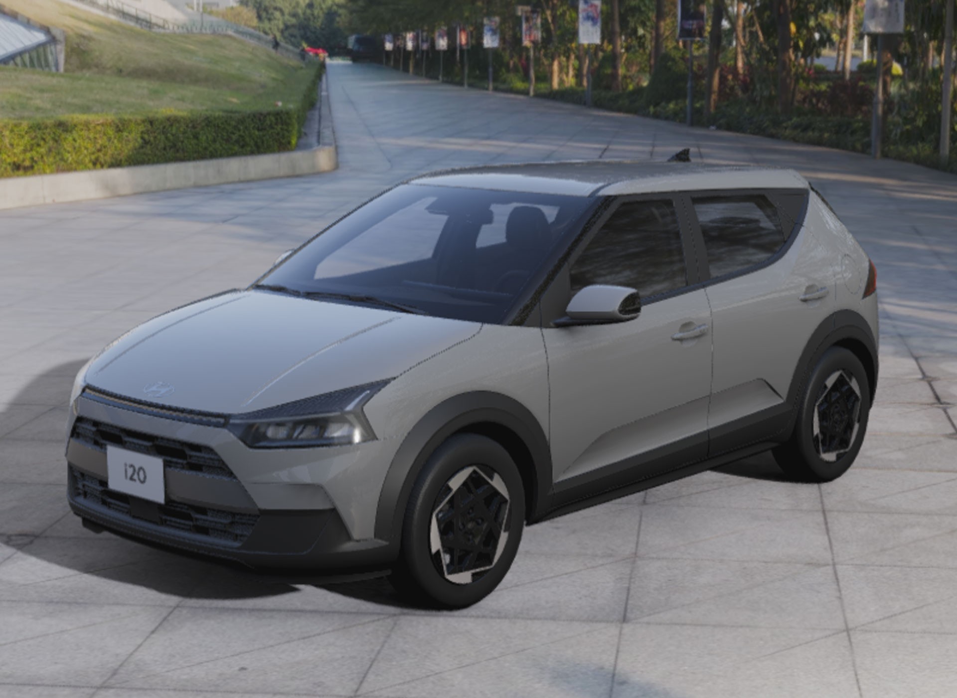 Carro cinza claro, modelo hatch, estacionado em uma rua pavimentada. Possui detalhes em preto fosco nos para-lamas e para-choques, e rodas pretas com design geom&eacute;trico. Ao fundo, uma &aacute;rea verde com arbustos e &aacute;rvores, e postes com bandeiras coloridas. A placa frontal exibe o n&uacute;mero 120
